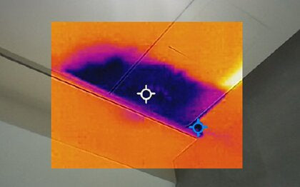 Thermal image of a ceiling with a cold patch spreading from a water leak
